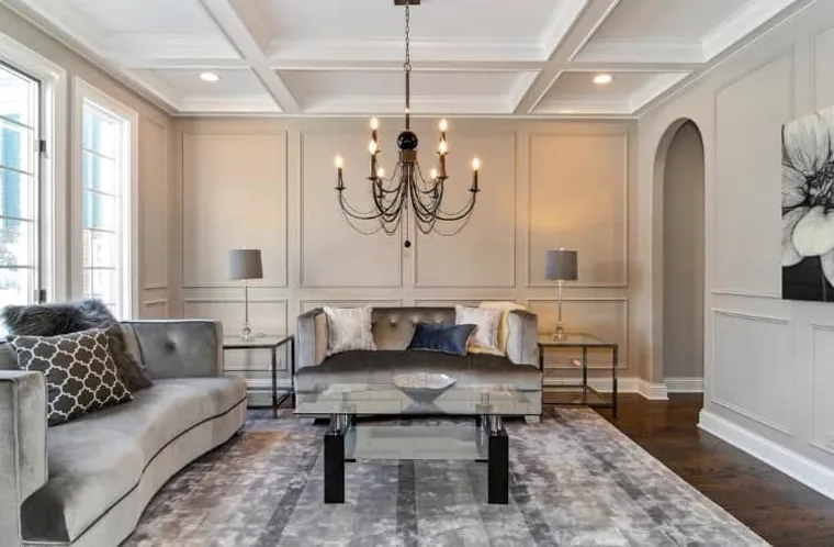 Finished living room with warm gray walls and crisp white trim